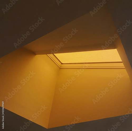 Orange smoke seen through a skylight