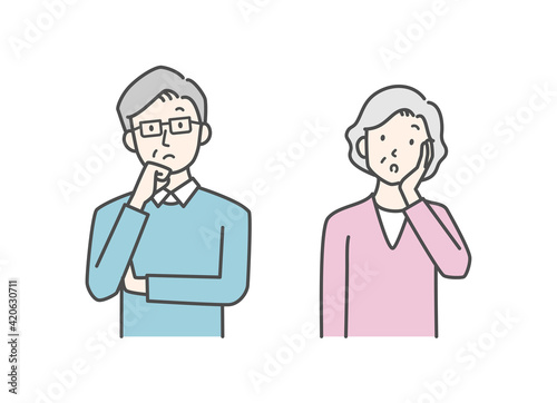 悩んでいるシニア男性とシニア女性