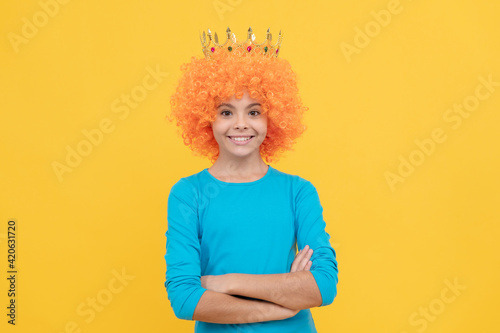 higher standard. teen girl in tiara. being a clown. april fools day. happy childhood.