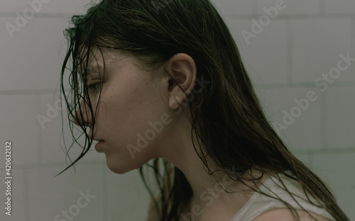 Portrait of a woman with black wet hair