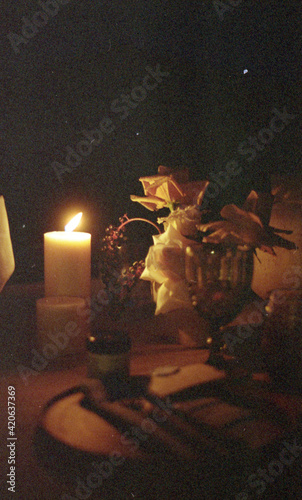 Night scene of a tablescape With Flowers and candles photo