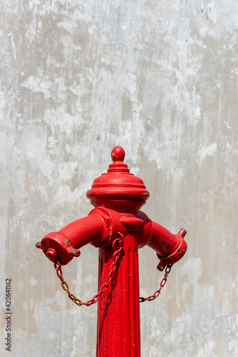 Fire hydrant isolated over a gray and white textured background