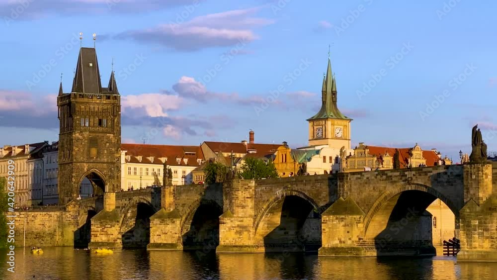 Scenic view of the Old Town pier architecture and Charles Bridge over Vltava river in Prague, Czech Republic. Prague iconic Charles Bridge (Karluv Most) and Old Town Bridge Tower at sunset, Czechia.