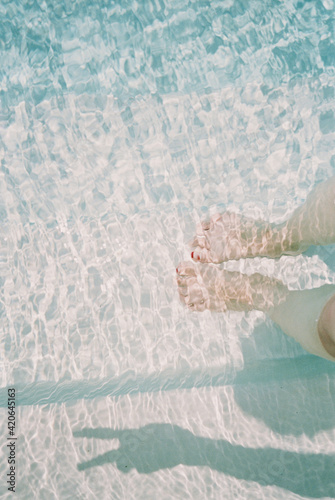 Feet In Water With Peace Sign Shadow photo