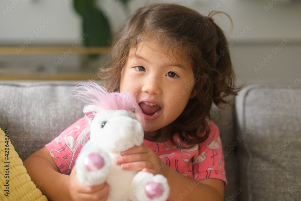 Playing with stuffed animal Playing with stuffed animal