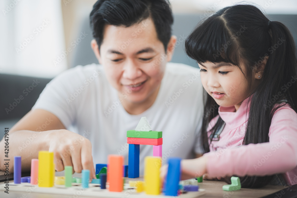 Asian girl and her family with father and mother are happy in education learning at home, concept of education and family learning, children daughter person girl happy together at home Asian girl and her family with father and mother are happy in education learning at home, concept of education and family learning, children daughter person girl happy together at home