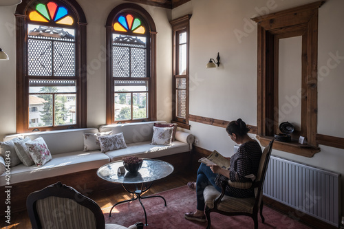 woman reading in traditional ottoman house photo
