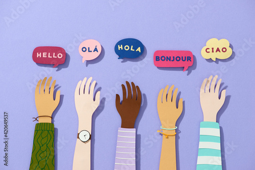 Group of Raised arms with speech box in different languages photo