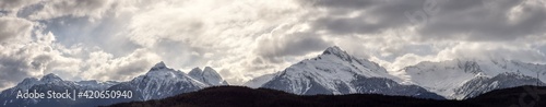 Panoramic Canadian Mountain Landscape View during a cloudy winter day. Taken in Tantalus Lookout near Squamish and Whistler  North of Vancouver  BC  Canada. Background Panorama