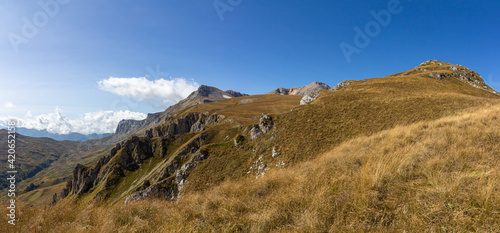 Panorama of mountains in autumn ,a place of rest and travel in the bosom of nature in the mountainous area of subalpine meadows. photo