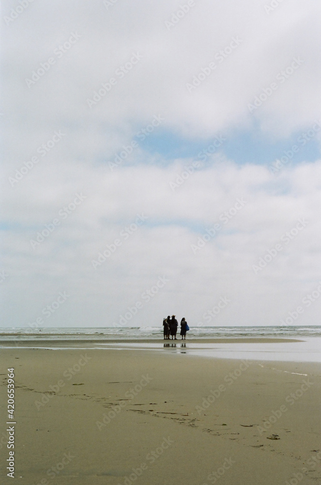 Unrecognizable nuns walking on the beach Unrecognizable nuns walking on the beach