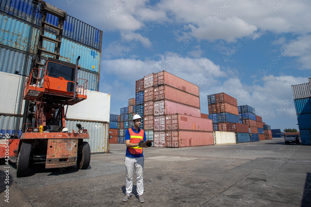 Portrait of happy man at cargo container.  Business logistic concept, Import and export concept