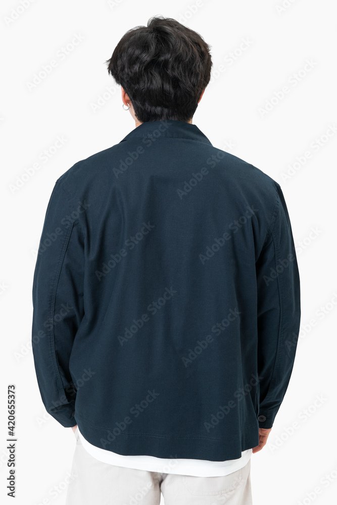 Man in simple navy jacket portrait street fashion rear view