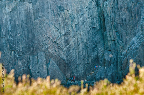 Far view of climber on slate wall in quarry