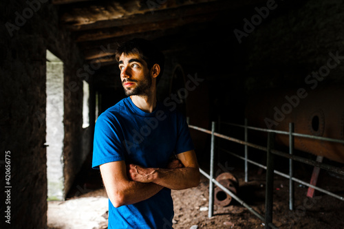 Tourist into to the walls of building in decay in quarry photo