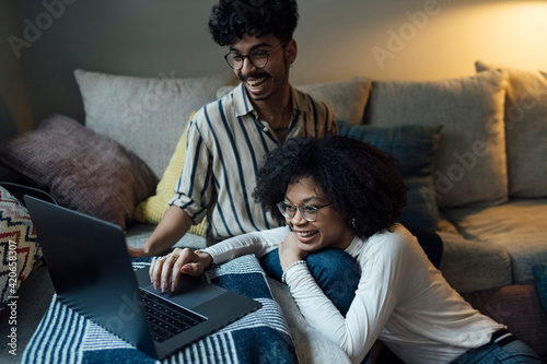 Young Black Couple using a Laptop at Home photo