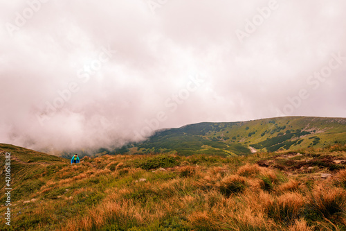 Time after the rain on the top of Gutyn Tomnatyk mountain, mystical fog and white clouds in the mountains, the beauty of the Montenegrin ridge.