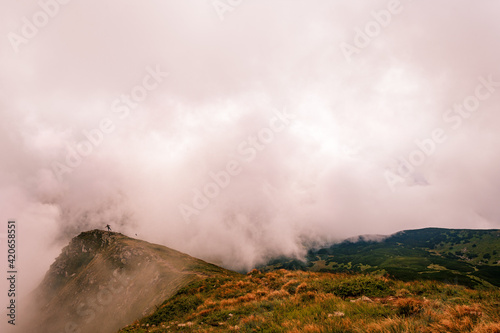 Time after the rain on the top of Gutyn Tomnatyk mountain, mystical fog and white clouds in the mountains, the beauty of the Montenegrin ridge.