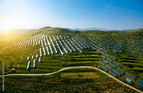 Bild auf Leinwand Solar photovoltaic base built by aerial photography mountain