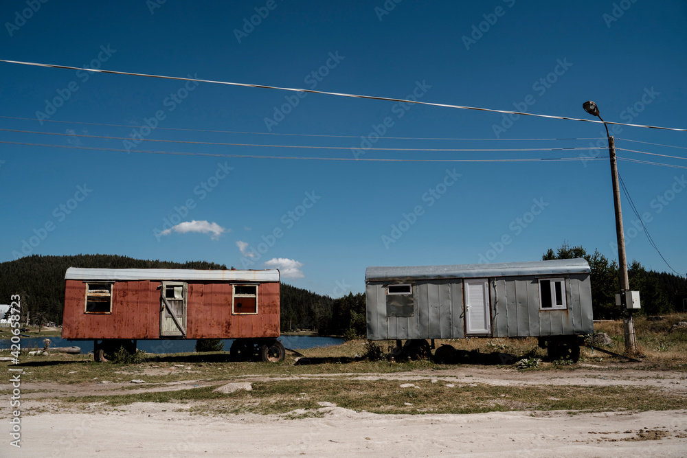 Old gipsy caravan next to lake Old gipsy caravan next to lake