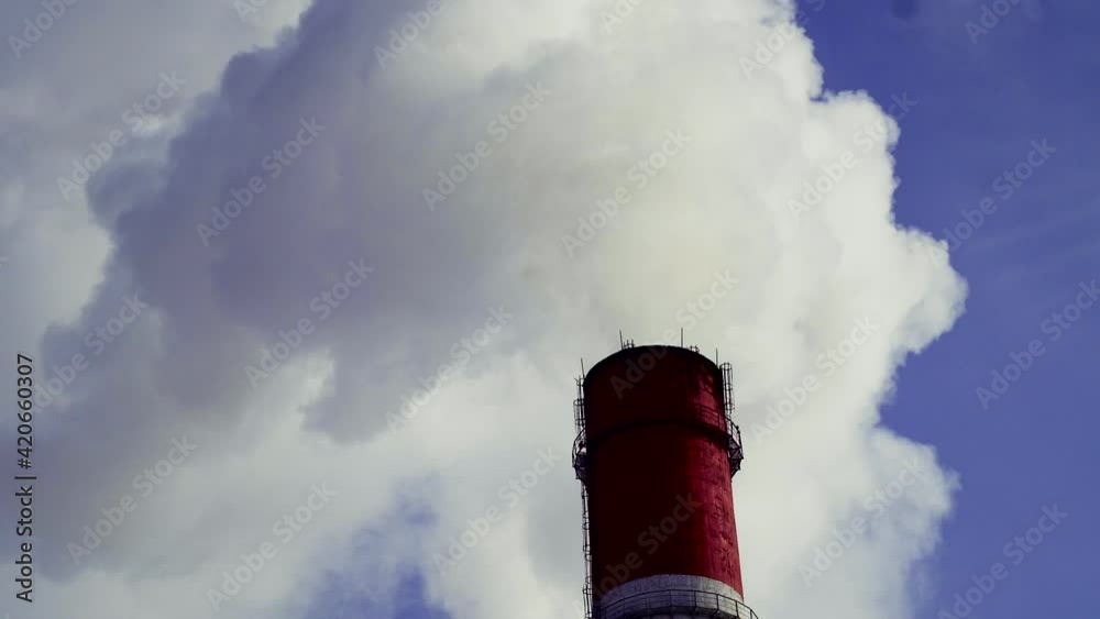 Smoke comes out of the pipe at the heat and power station Smoke comes out of the pipe at the heat and power station