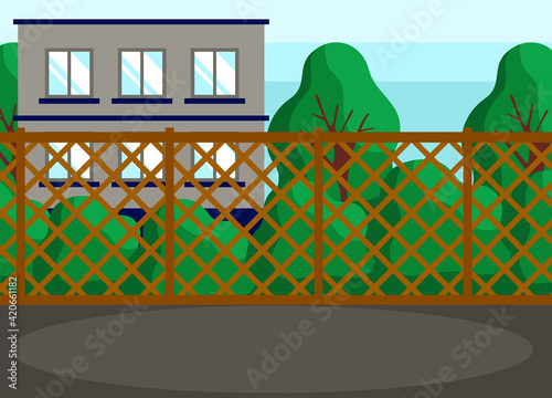 Green spaces and building behind carved wooden fence. Place or hanging out and hosting events
