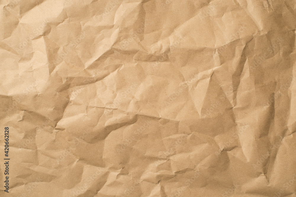 Top view photo of isolated beige crumpled craft paper background with copyspace Top view photo of isolated beige crumpled craft paper background with copyspace