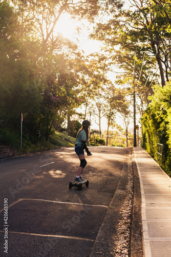 Wallpaper Mural teen skating on the road on an electric skateboard Torontodigital.ca