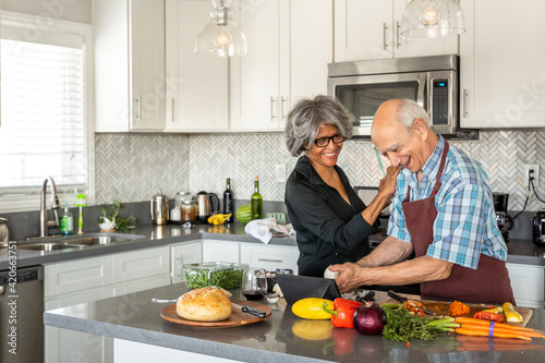 Woman Caresses Partner While Cooking