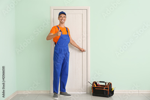 Worker showing thumb-up nea...