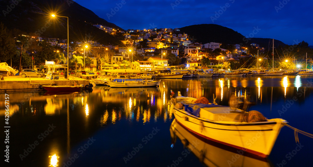 Kas Harbour at night as viewed from the sea, Lycian Coast, Turkey