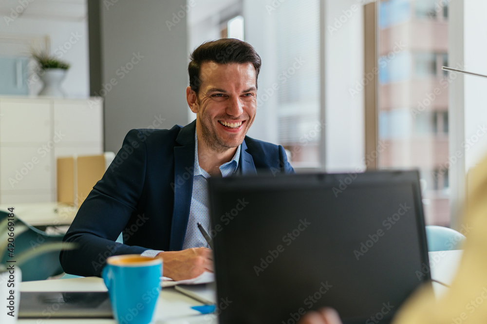 Cheerful colleagues working in office Cheerful colleagues working in office