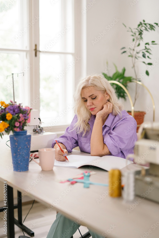 Fashion designer working in studio Fashion designer working in studio