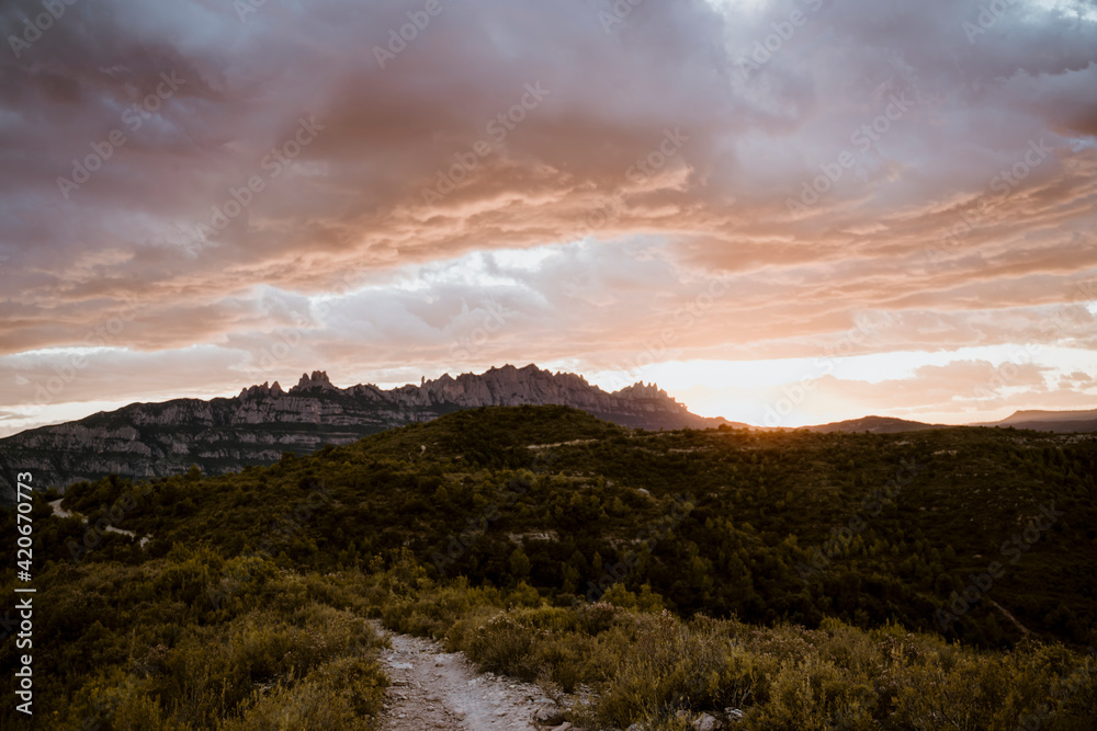 Beautiful sunset landscape with mountain and clouds Beautiful sunset landscape with mountain and clouds