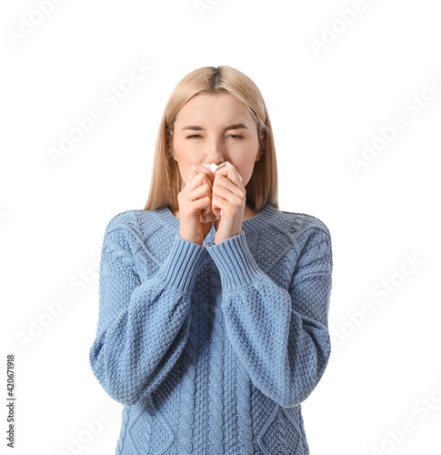 Sick young woman on white b...