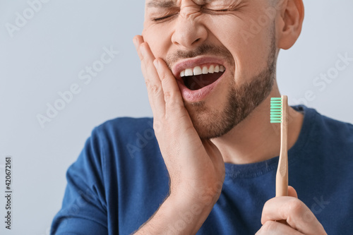 Man with aching teeth and b...