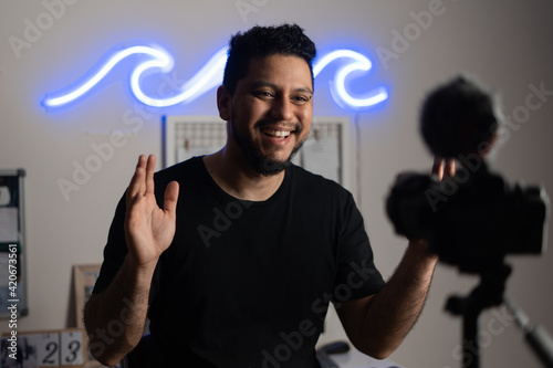 man recording himself video at home studio photo