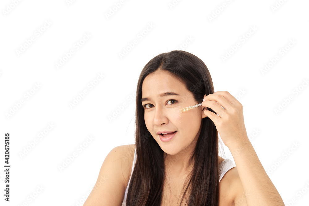 Woman applying oil serum from the pipette. Natural organic cosmetic Woman applying oil serum from the pipette. Natural organic cosmetic