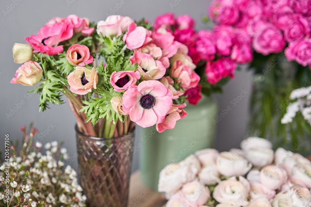 Set of white, pink and magenta flowers for Interior decorations. The work of the florist at a flower shop. Fresh cut flower.