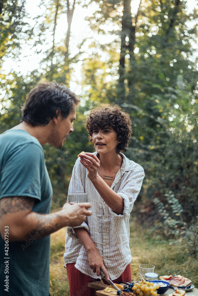 A Man and a Woman Picnicking in Nature A Man and a Woman Picnicking in Nature