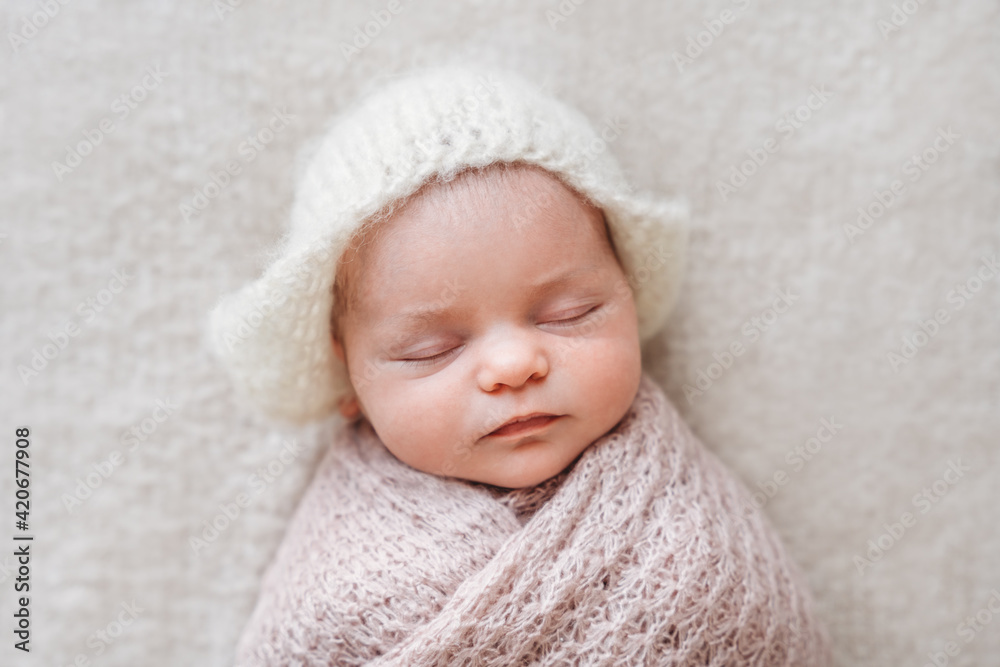 Beautiful sleeping baby wearing a cute hat Beautiful sleeping baby wearing a cute hat