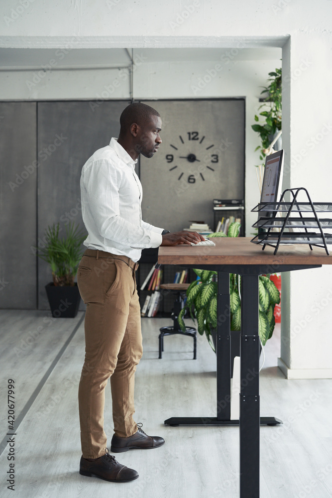 Businessman at electric desk. Businessman at electric desk.