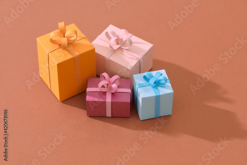 Handcraft gift box and christmas tree isolated on color background