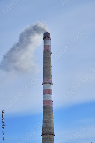 Industrial landscape, pipes with smoke. Air pollution by smoke paths