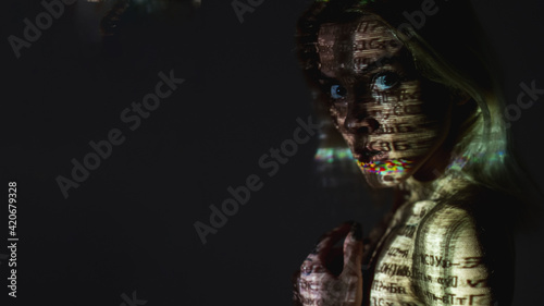 Silhouette female portrait. Cyber security. Hacker attack. Server code. Computer bug. Scared woman with reflected text glitch on face body isolated on dark double exposure copy space.