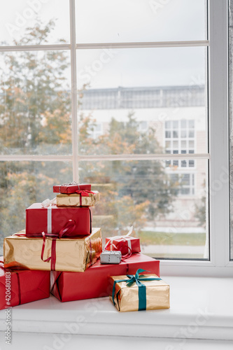 Stack of presents placed on windowsill
