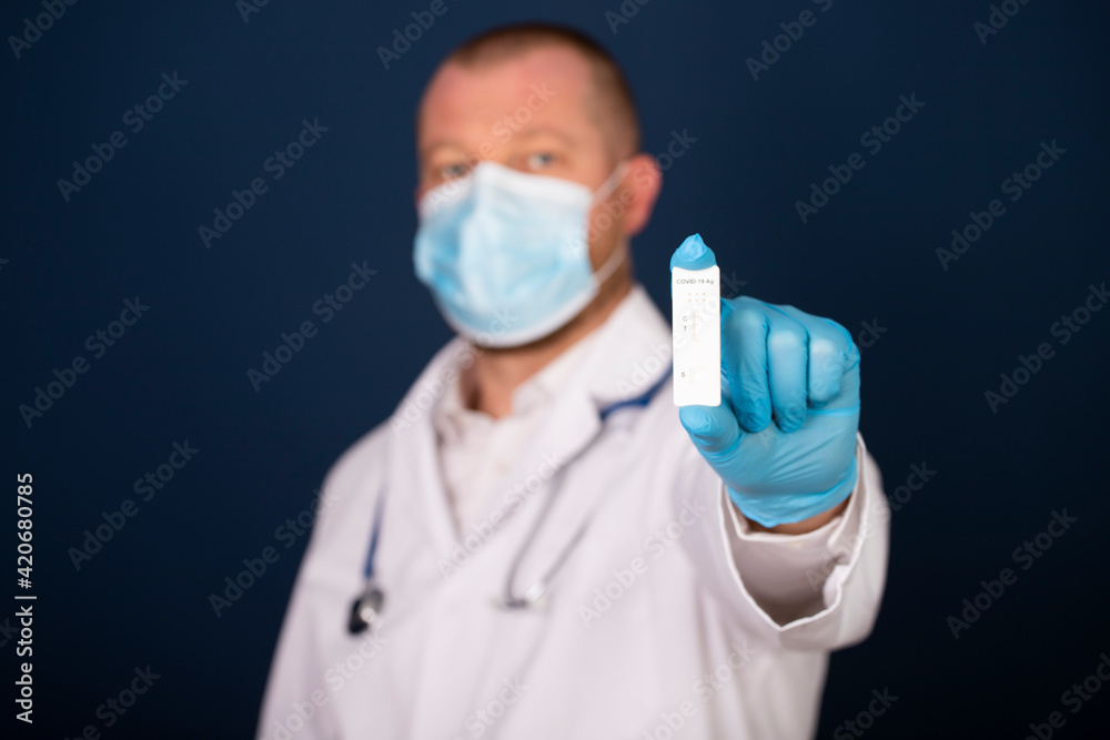 Medic hands in gloves holding negative COVID-19 test, rapid test kit for diagnosis Coronavirus infection Medic hands in gloves holding negative COVID-19 test, rapid test kit for diagnosis Coronavirus infection