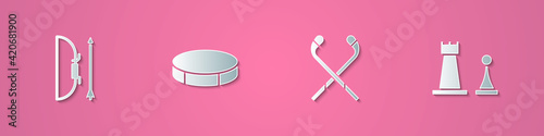 Set paper cut Bow and arrow in quiver, Hockey puck, Ice hockey sticks and Chess icon. Paper art style. Vector