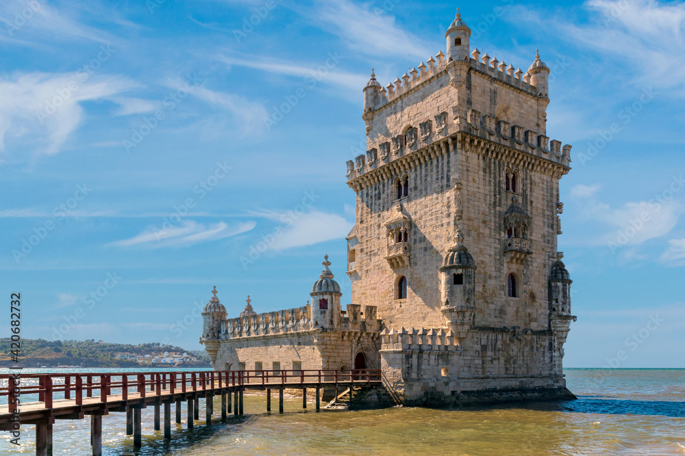 Scenic Belem Tower and wooden bridge miroring with low tides on Tagus River. Torre de Belem is Unesco Heritage and icon of Lisbon and the most visited attraction in Lisbon, Belem District, Portugal