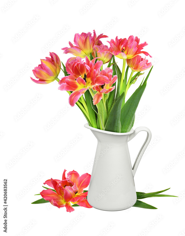 Yellow and orange tulip flowers in a white jar isolated on white